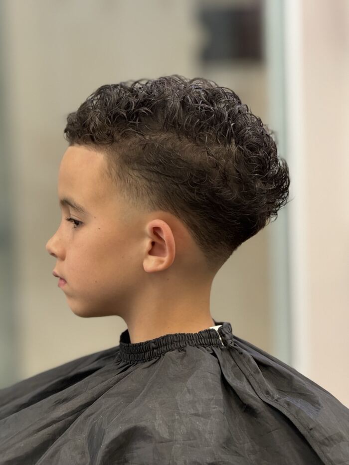 Kids' curly top with a taper fade, cut at Ricky's Style Barbershop, Royal Palm Beach FL