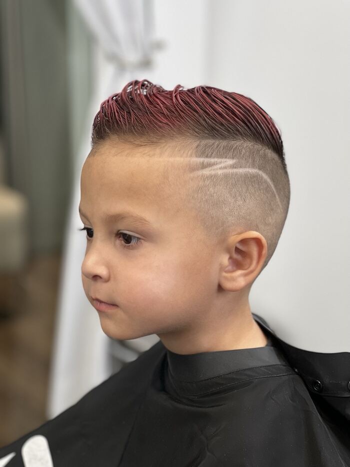 Kids' high skin fade with red color and a shaved design, Royal Palm Beach FL