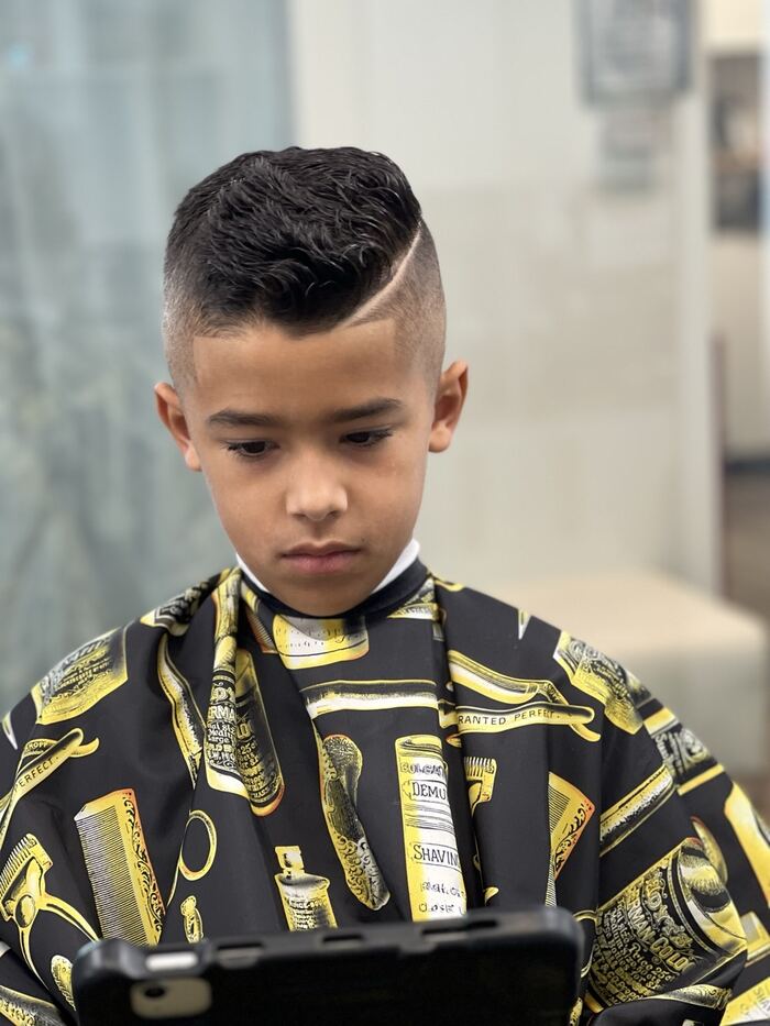Kids' high skin fade with a textured top and hard part, Ricky's Style Barbershop, Royal Palm Beach