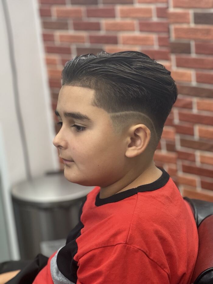 Kids' low taper fade with a slick-back top and hard part, Royal Palm Beach FL