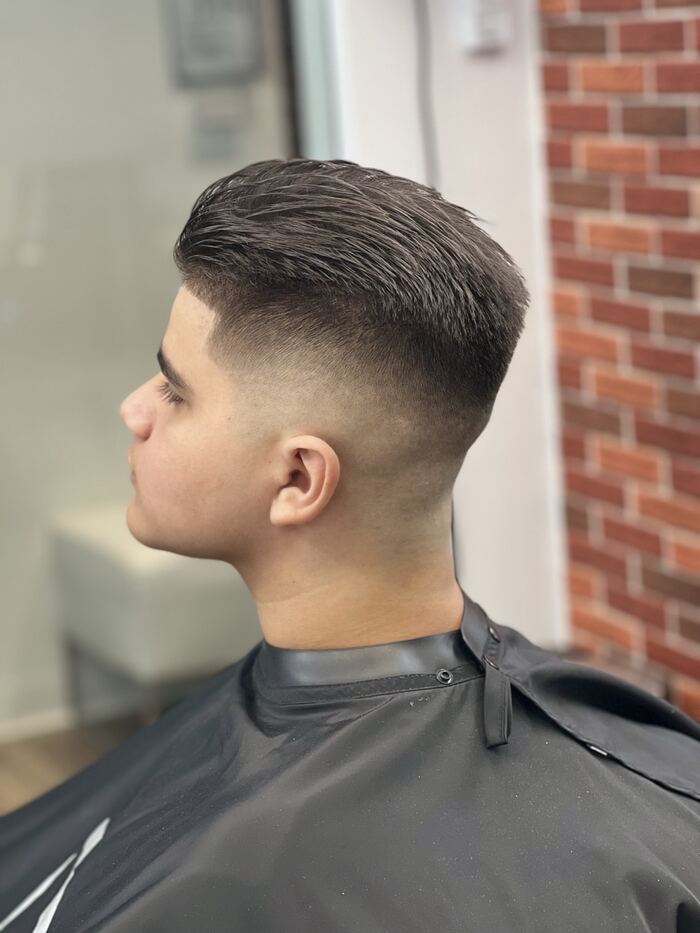 Mid drop fade with a textured comb-over, cut at Ricky's Style Barbershop, Royal Palm Beach FL